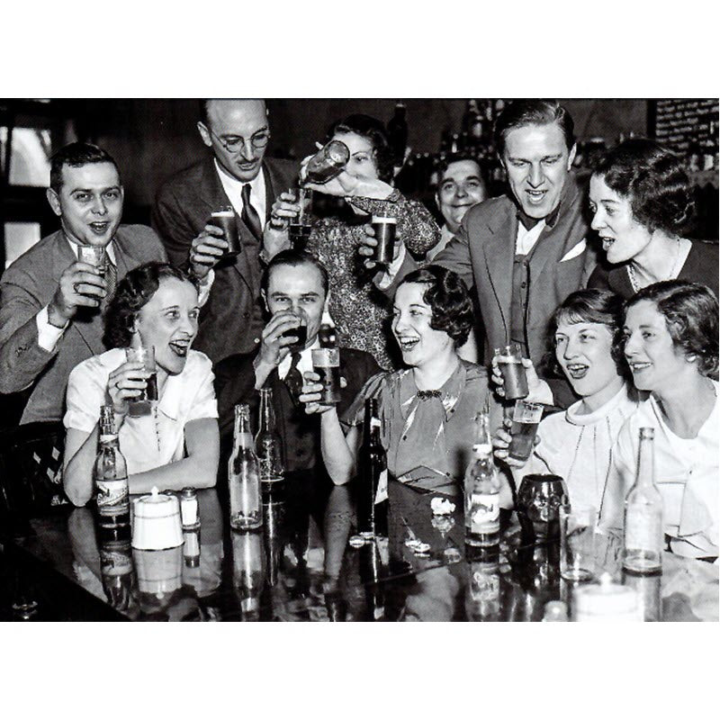 Front of the image that shows a group of men and women drinking at a bar. The image was taken in 1933.
