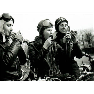 The front of the card shows three glamorous biker girls all applying lipstick and the picture was taken in the 1950s.